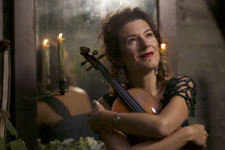 Alda Dizdari performing with violin
